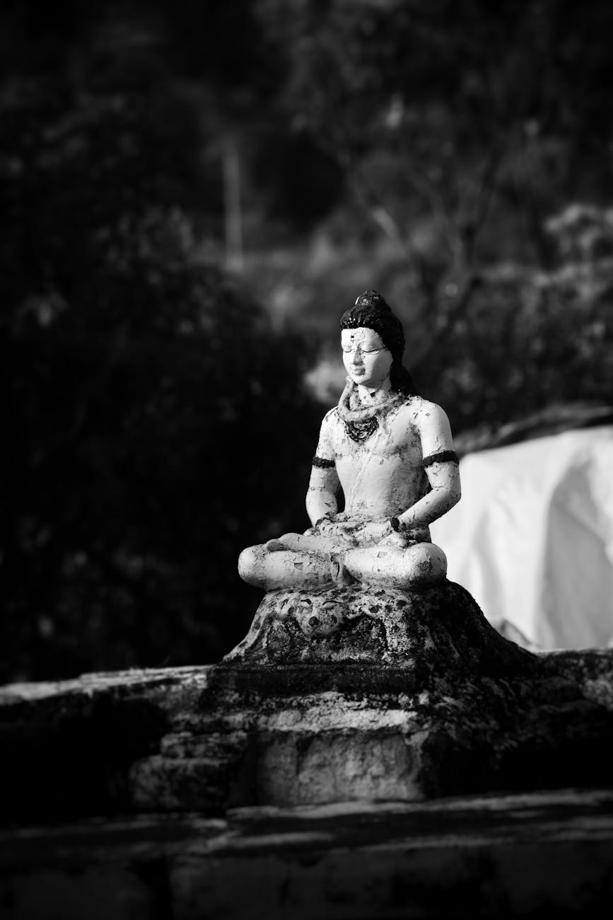 grayscale photography of an old statue